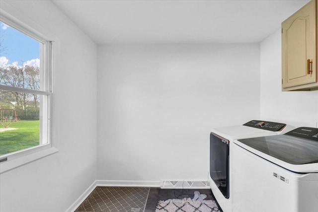 415 E 14th St, Gibson City, IL 60936 - laundry room featuring washer and dryer, a wealth of natural light, cabinet space, and baseboards