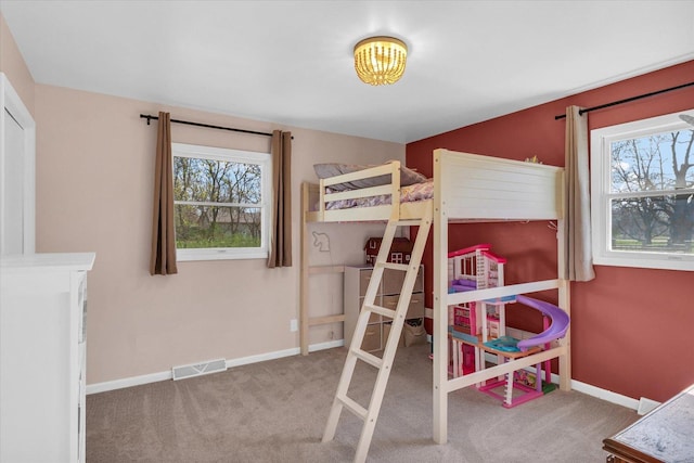 415 E 14th St, Gibson City, IL 60936 - carpeted bedroom with visible vents and baseboards