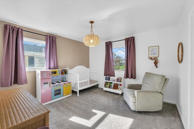 415 E 14th St, Gibson City, IL 60936 - carpeted bedroom featuring a nursery area and multiple windows