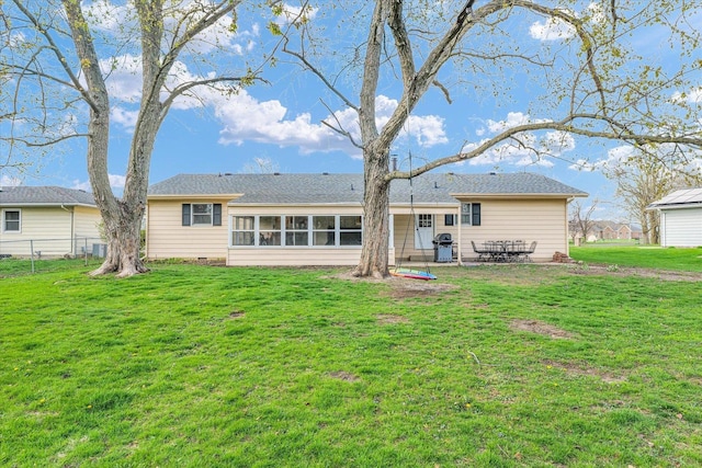 415 E 14th St, Gibson City, IL 60936 - rear view of house featuring a patio area, a lawn, a sunroom, and fence