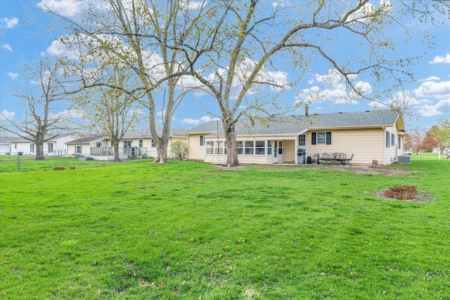 415 E 14th St, Gibson City, IL 60936 - back of house with fence and a lawn