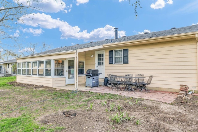 415 E 14th St, Gibson City, IL 60936 - back of property with a sunroom and a patio