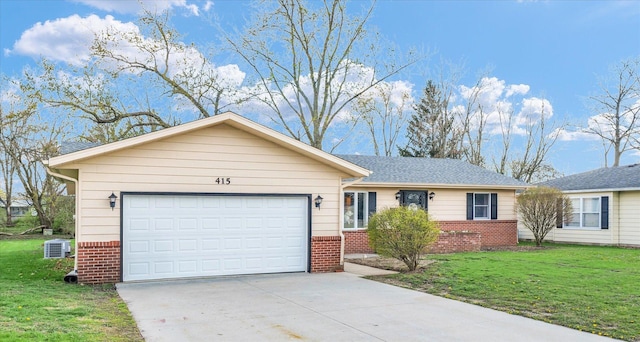 415 E 14th St, Gibson City, IL 60936 - ranch-style house featuring a front lawn, central air condition unit, concrete driveway, brick siding, and an attached garage