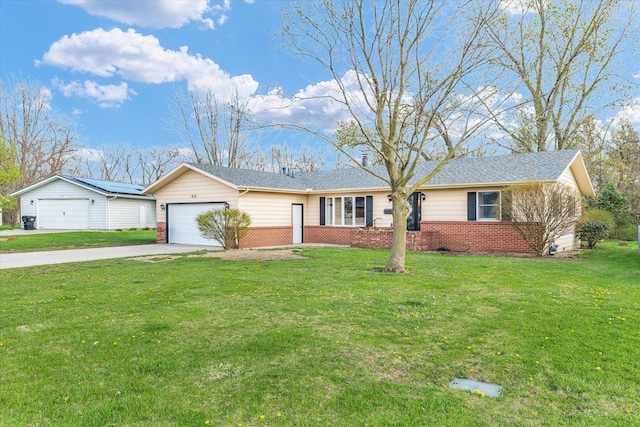 415 E 14th St, Gibson City, IL 60936 - ranch-style house featuring a front lawn, brick siding, driveway, and an attached garage