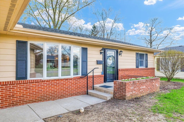 415 E 14th St, Gibson City, IL 60936 - view of exterior entry with brick siding