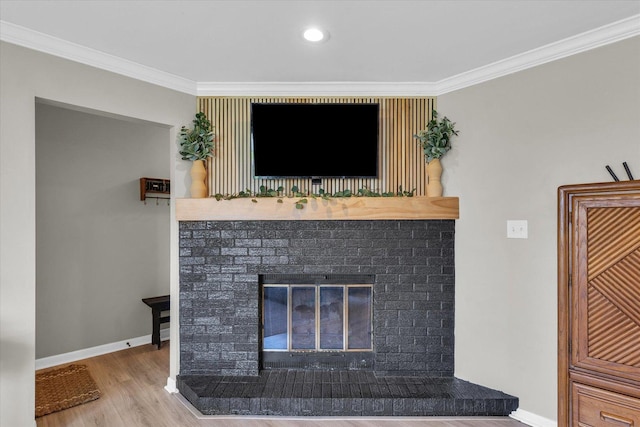 415 E 14th St, Gibson City, IL 60936 - details with baseboards, ornamental molding, a brick fireplace, and wood finished floors