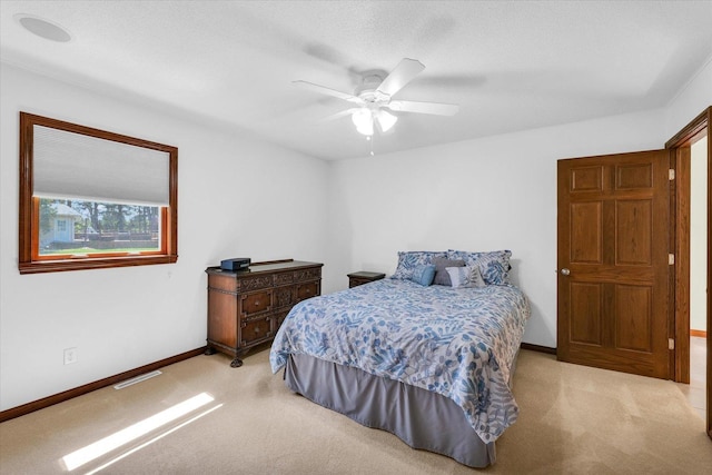 2 Woodland Dr, White Heath, IL 61884 - bedroom with light carpet, baseboards, and ceiling fan