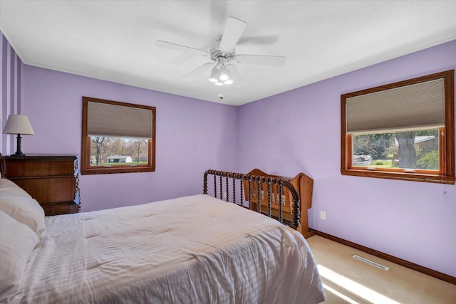2 Woodland Dr, White Heath, IL 61884 - bedroom with carpet, baseboards, and ceiling fan