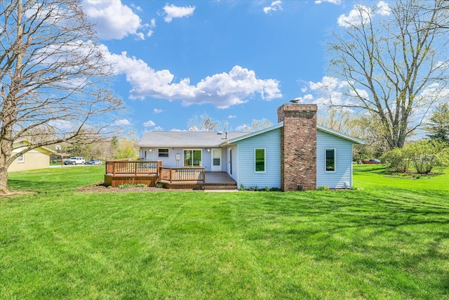 2 Woodland Dr, White Heath, IL 61884 - back of property featuring a chimney, a wooden deck, and a yard