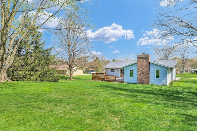 2 Woodland Dr, White Heath, IL 61884 - view of grassy yard featuring a deck