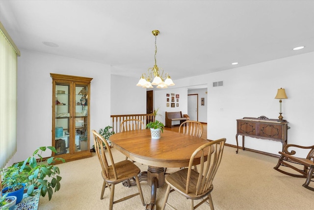 2 Woodland Dr, White Heath, IL 61884 - dining area with light colored carpet, a chandelier, and recessed lighting