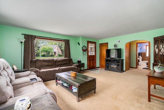 918 Dawes Ave, Joliet, IL 60435 - living room with arched walkways and light carpet