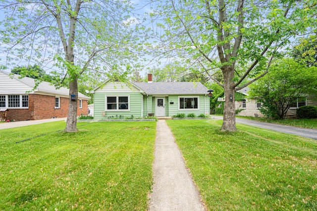 918 Dawes Ave, Joliet, IL 60435 - view of front of house featuring a front lawn and a chimney