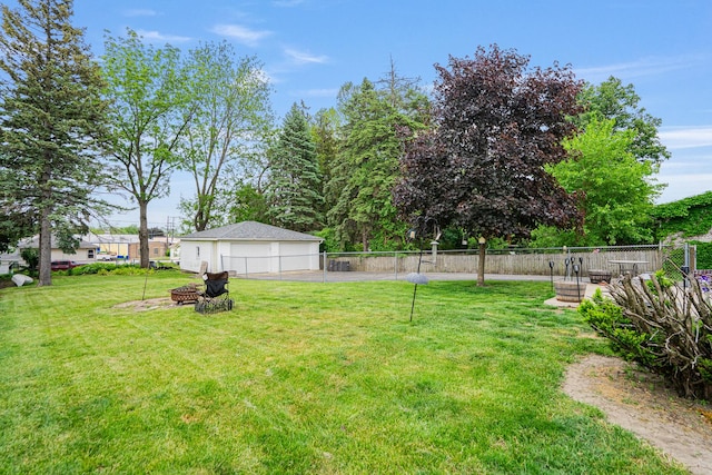 918 Dawes Ave, Joliet, IL 60435 - view of yard featuring a garage and an outdoor fire pit