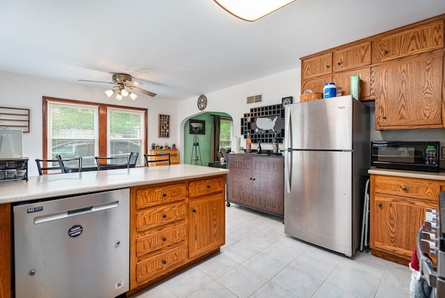918 Dawes Ave, Joliet, IL 60435 - kitchen featuring appliances with stainless steel finishes, ceiling fan, light countertops, and healthy amount of natural light