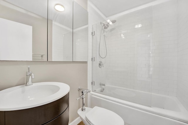 bathroom featuring toilet, shower / bath combination, and vanity