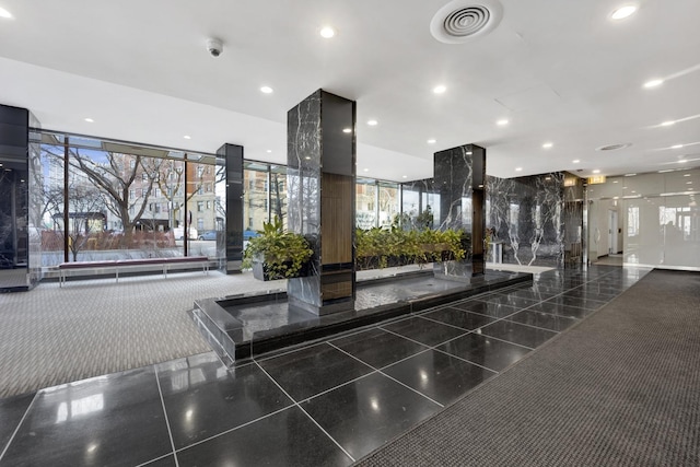 building lobby featuring visible vents