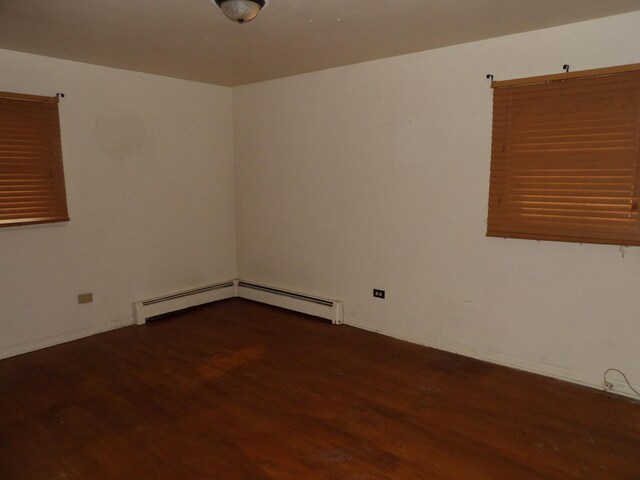 16315 Kenwood Ave, South Holland, IL 60473 - empty room featuring baseboards, wood finished floors, and a baseboard radiator