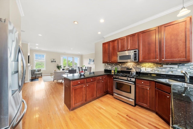 3443 N Lincoln Ave Unit 4A, Chicago, IL 60657 - kitchen featuring stainless steel appliances, a sink, a peninsula, open floor plan, and light wood finished floors
