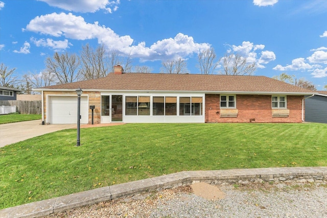 510SOUTHLANDCIRCLE Tuscola Dr, Tuscola, IL 61953 - ranch-style home featuring a chimney, driveway, a front yard, brick siding, and a garage