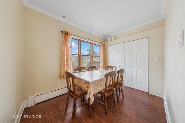 dining room featuring crown molding, baseboards, wood finished floors, and baseboard heating