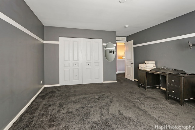 carpeted bedroom with visible vents, baseboards, and a closet