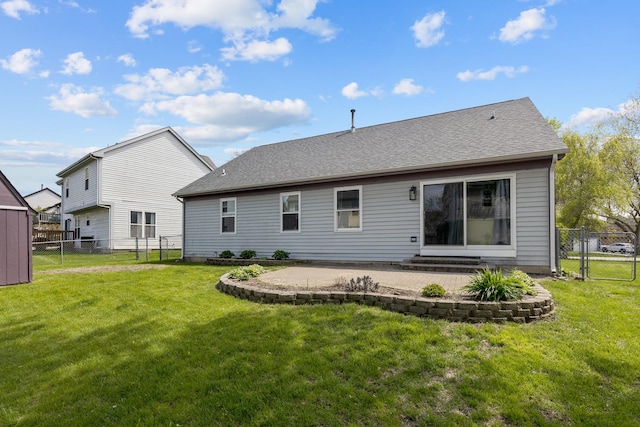 rear view of house featuring a patio, a gate, and a shingled roof