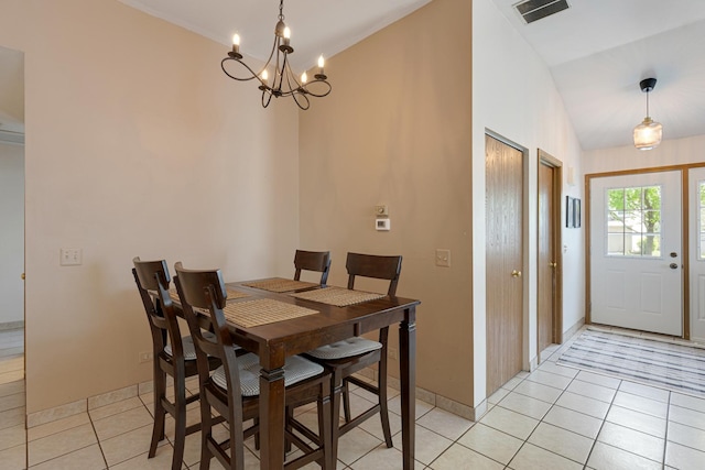 dining room with light tile patterned floors, a chandelier, and baseboards