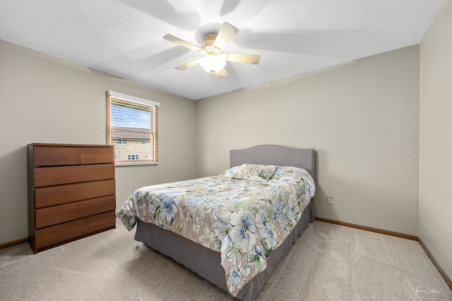 bedroom with baseboards, a ceiling fan, and carpet flooring