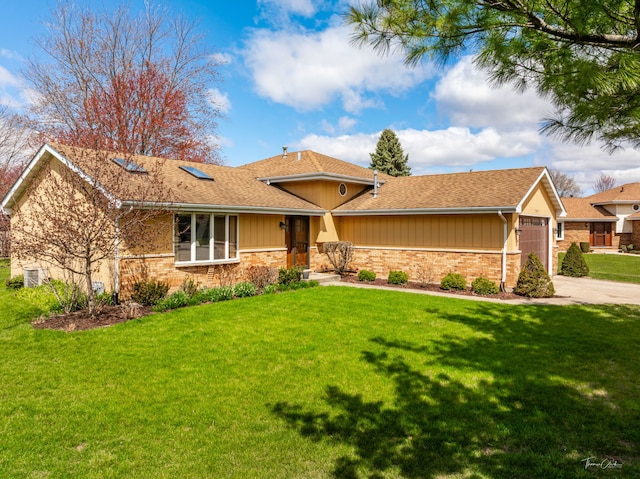 ranch-style house featuring a shingled roof, a front lawn, concrete driveway, brick siding, and a garage