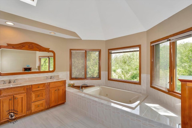 full bathroom with a tub with jets, double vanity, vaulted ceiling, tile patterned flooring, and recessed lighting