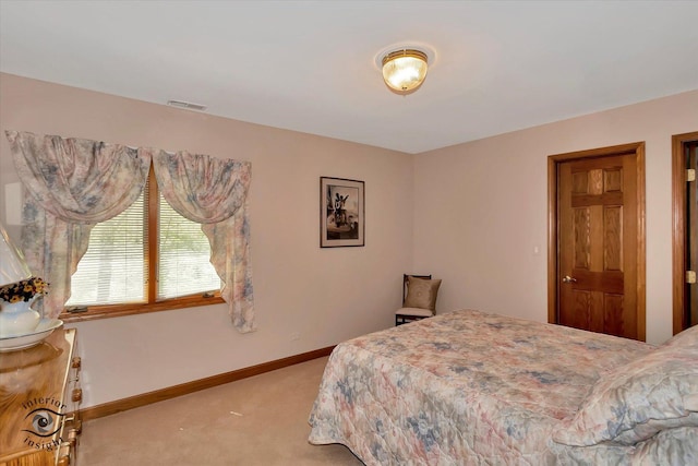 carpeted bedroom with baseboards