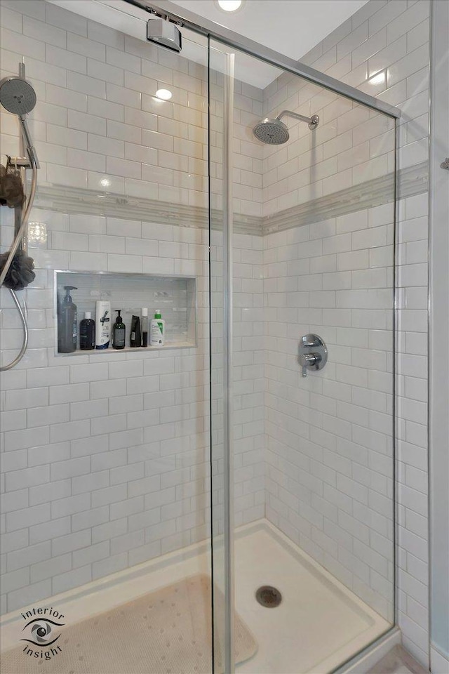 full bath featuring a shower stall