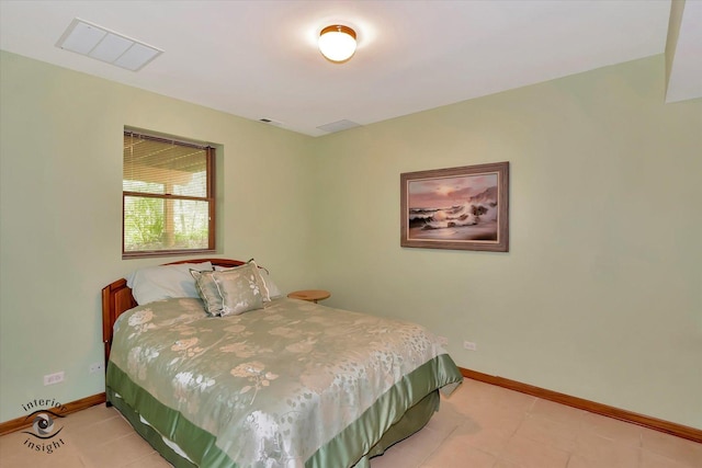 bedroom featuring baseboards and light tile patterned flooring