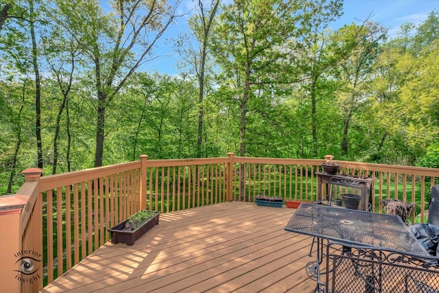 deck featuring a view of trees