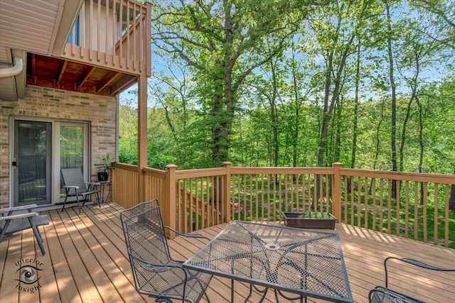 wooden deck with outdoor dining area
