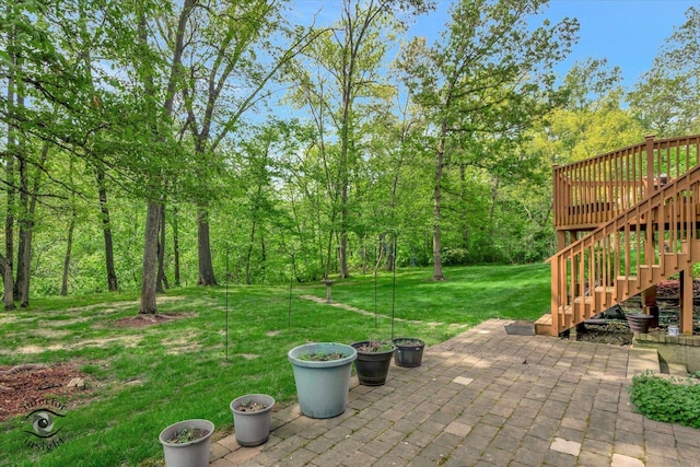 view of patio / terrace with stairway and a deck