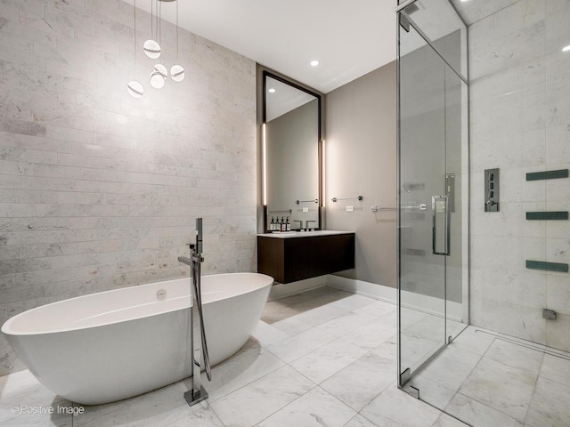 2035 N Orleans St Unit 2N, Chicago, IL 60614 - full bathroom featuring a freestanding tub, a shower stall, recessed lighting, vanity, and marble finish floor