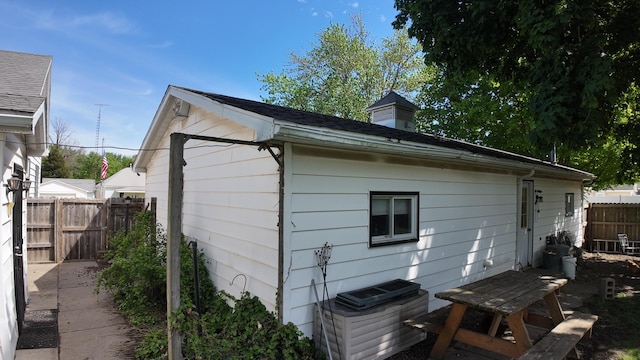 view of home's exterior with fence