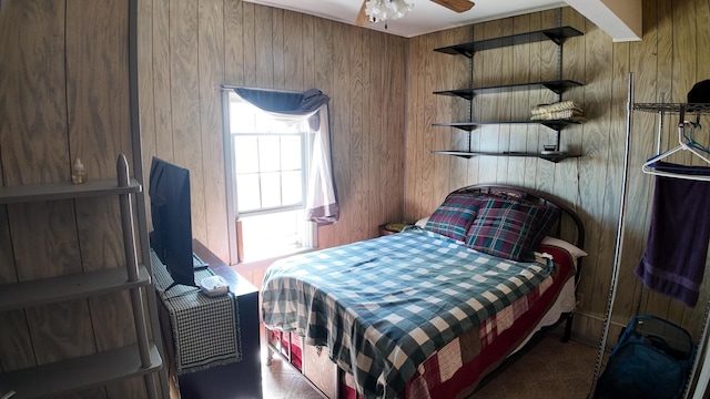 bedroom with wood walls