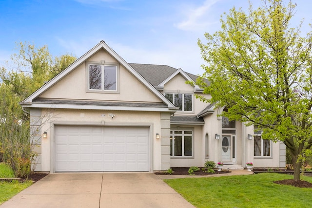 view of front of home featuring an attached garage, stucco siding, roof with shingles, a front yard, and driveway