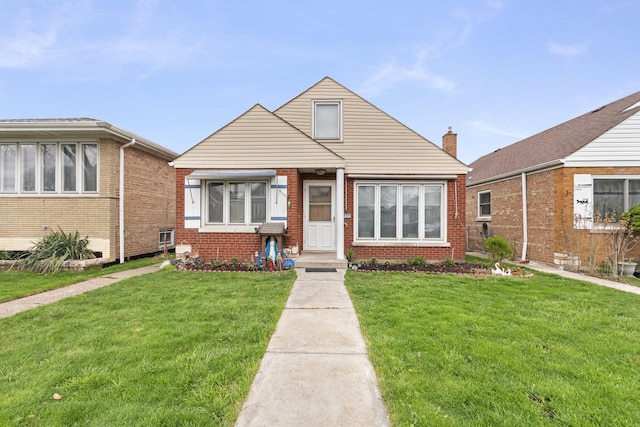 bungalow-style house featuring a front yard and brick siding