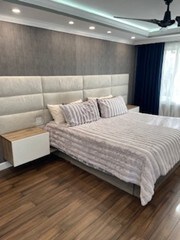bedroom with wood finished floors and recessed lighting