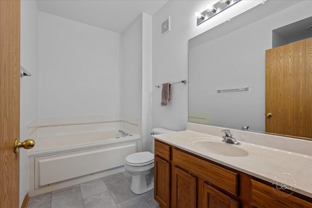 full bathroom with tile patterned flooring, toilet, a garden tub, and vanity