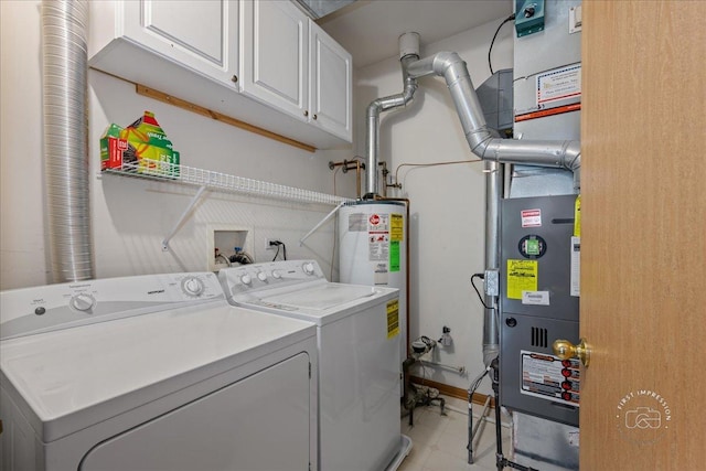 clothes washing area with independent washer and dryer, cabinet space, and gas water heater