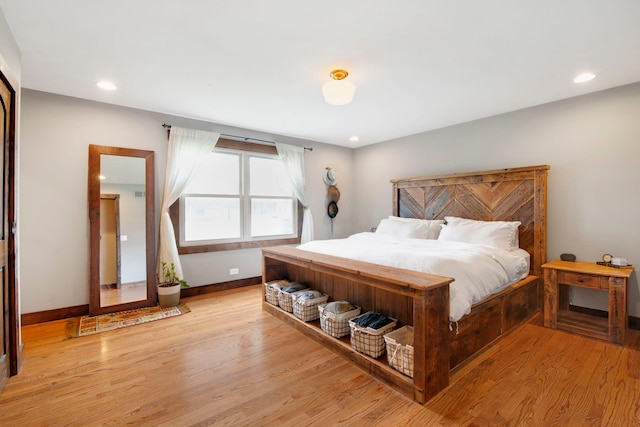bedroom with baseboards, light wood-style floors, and recessed lighting