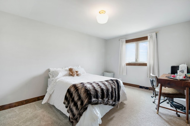 bedroom featuring carpet floors and baseboards