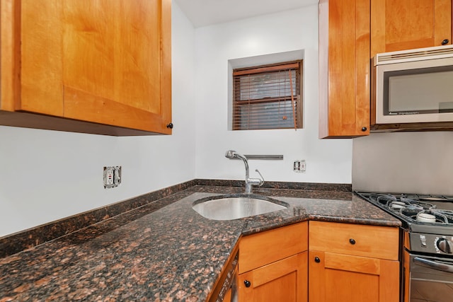 5014 N Oakley Ave Unit G, Chicago, IL 60625 - kitchen with stainless steel microwave, a sink, black gas range, and dark stone counters