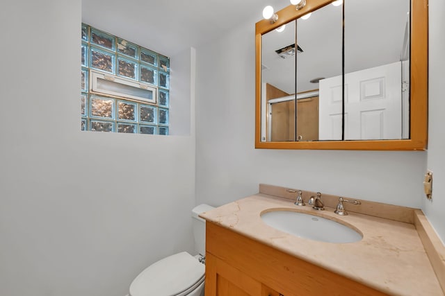5014 N Oakley Ave Unit G, Chicago, IL 60625 - bathroom featuring toilet, an enclosed shower, and vanity