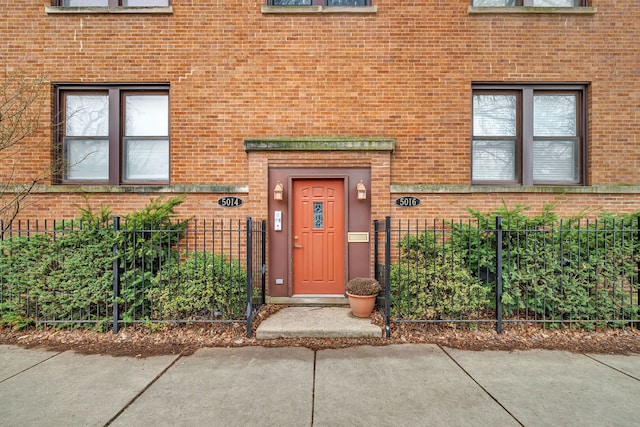 5014 N Oakley Ave Unit G, Chicago, IL 60625 - view of exterior entry with brick siding and fence